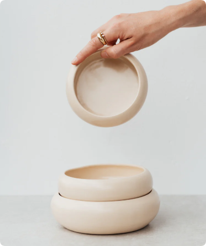 a set of stackable ceramic bowls