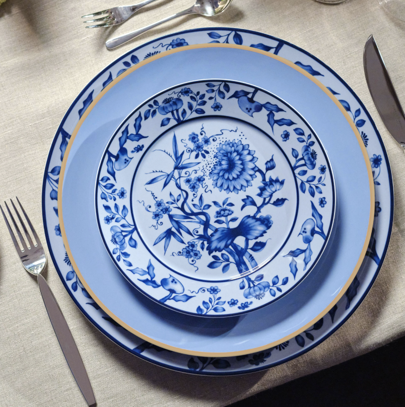 a white porcelain plate with a blue brushstroke effects